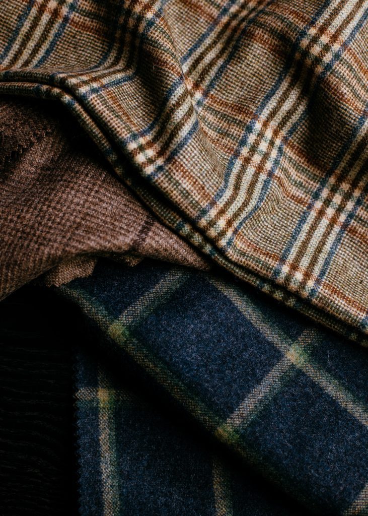 Using the beauty of woollen yarn and a double mill finish, John Foster have created an extension to their Oxbridge Flannel family in relaxed modern jacketing and suiting fabrics. Contemporary windowpanes, traditional gun club and shepherd check designs interspersed with semi-plains in complementary and classic tones