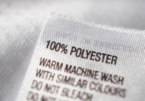 Polyester fabric Clothing label with laundry instructions Adobe stock