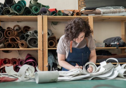 Adobe Woman tanner at work in the workshop