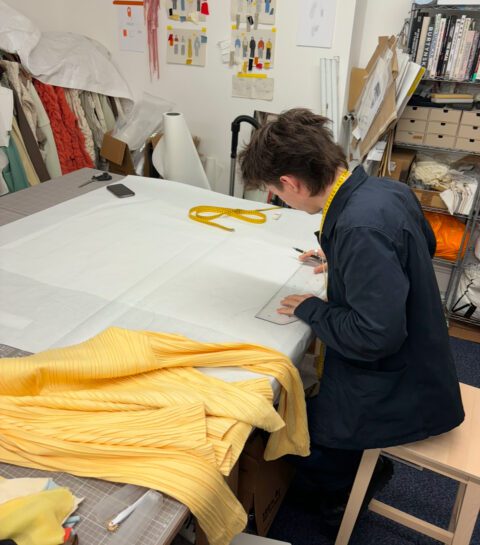 Fashion design student working on a pattern