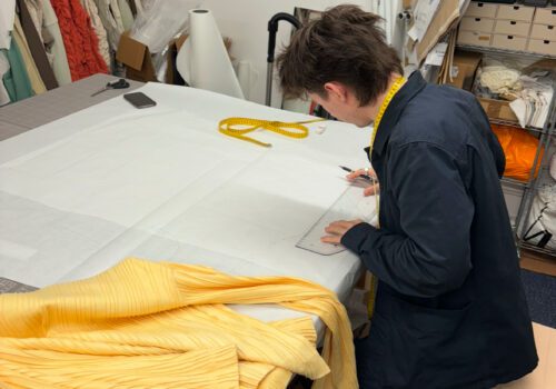 Fashion design student working on a pattern
