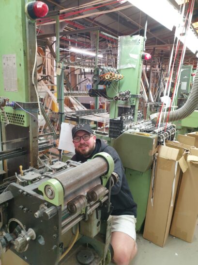 Bowmer Bond trainee working on the machine